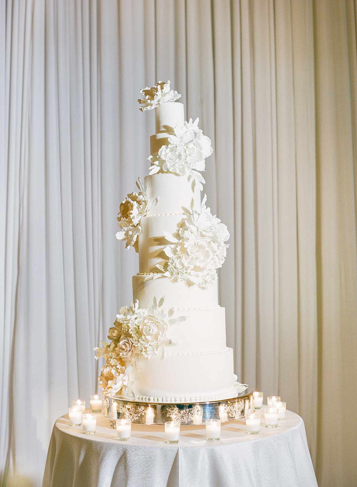 brittany brian wedding tall cake with floral decor