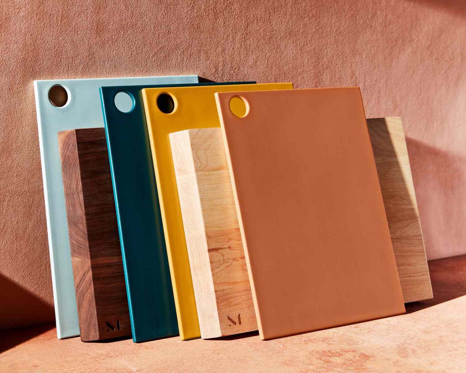 stack of cutting boards on a surface