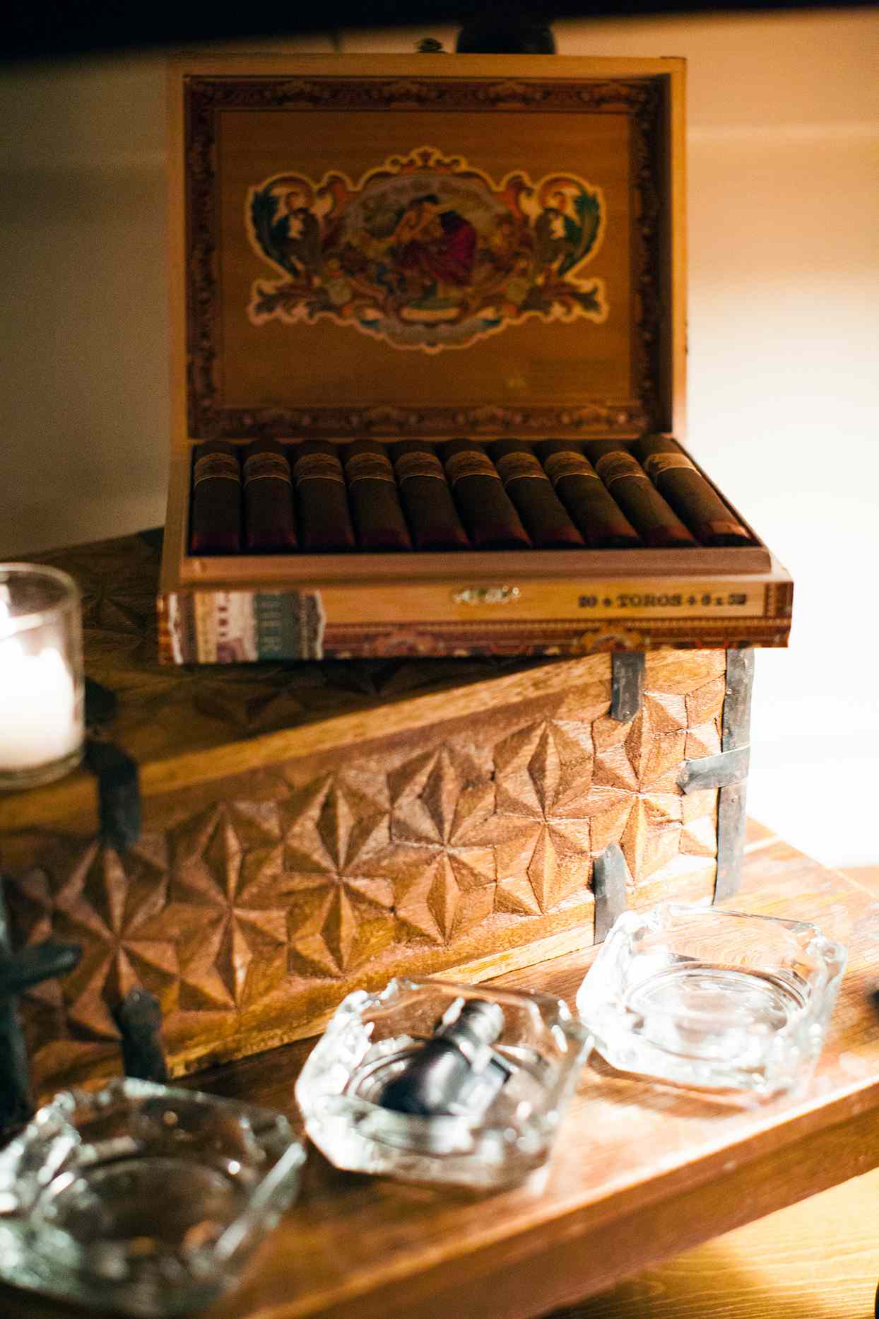 ornate cigar box on wooden table at welcome party