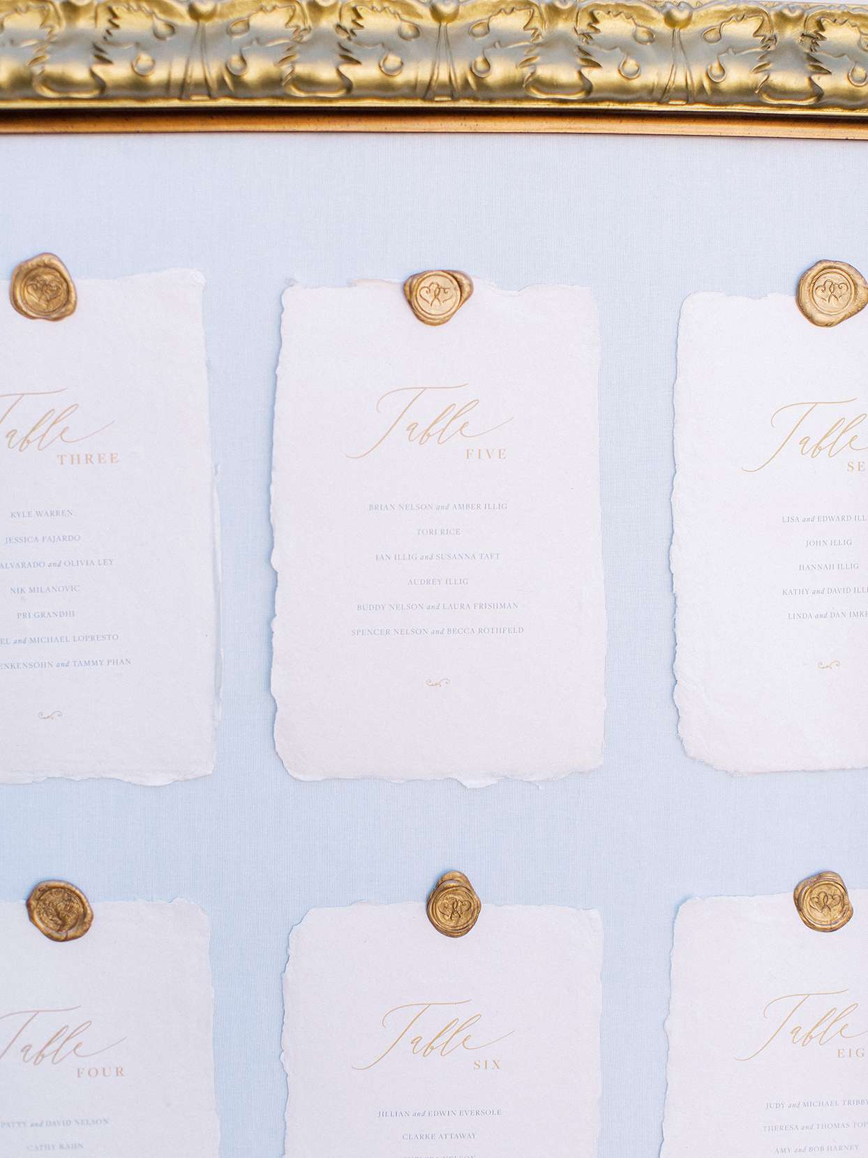 rustic ripped paper and golden seal seating chart