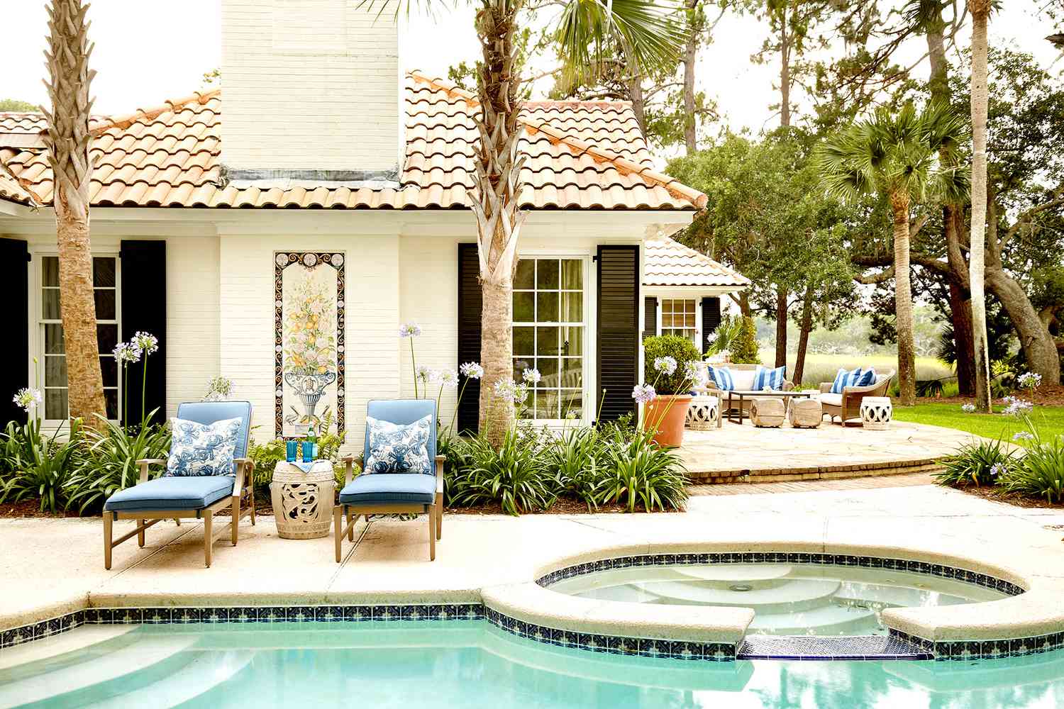 Backyard with pool and lounge chairs