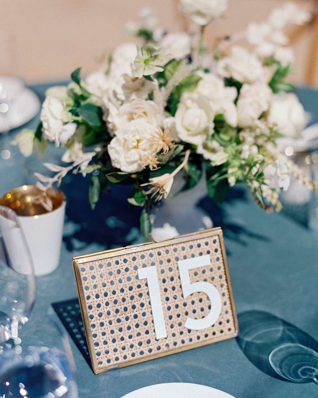 sage-colored velvet linens cane backing table numbers
