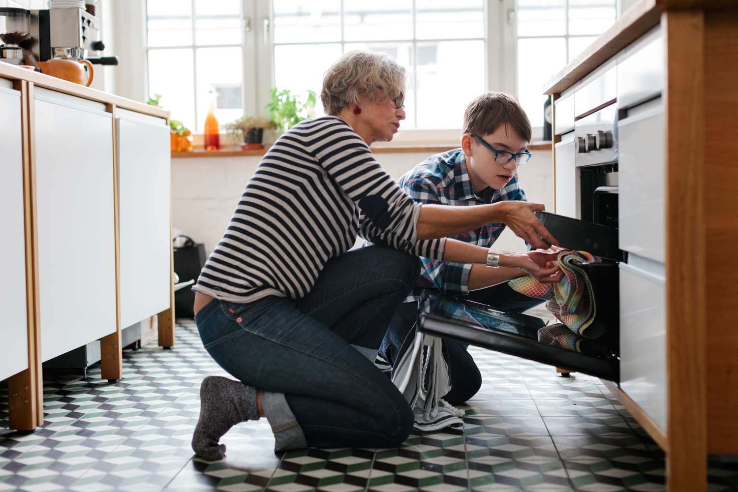 woman baking with grandson