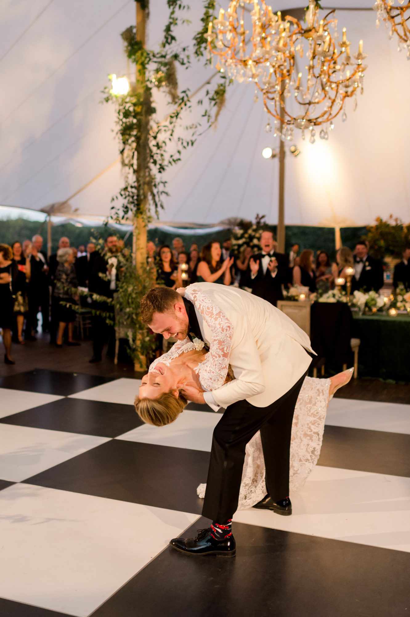 groom dipping bride on dance floor