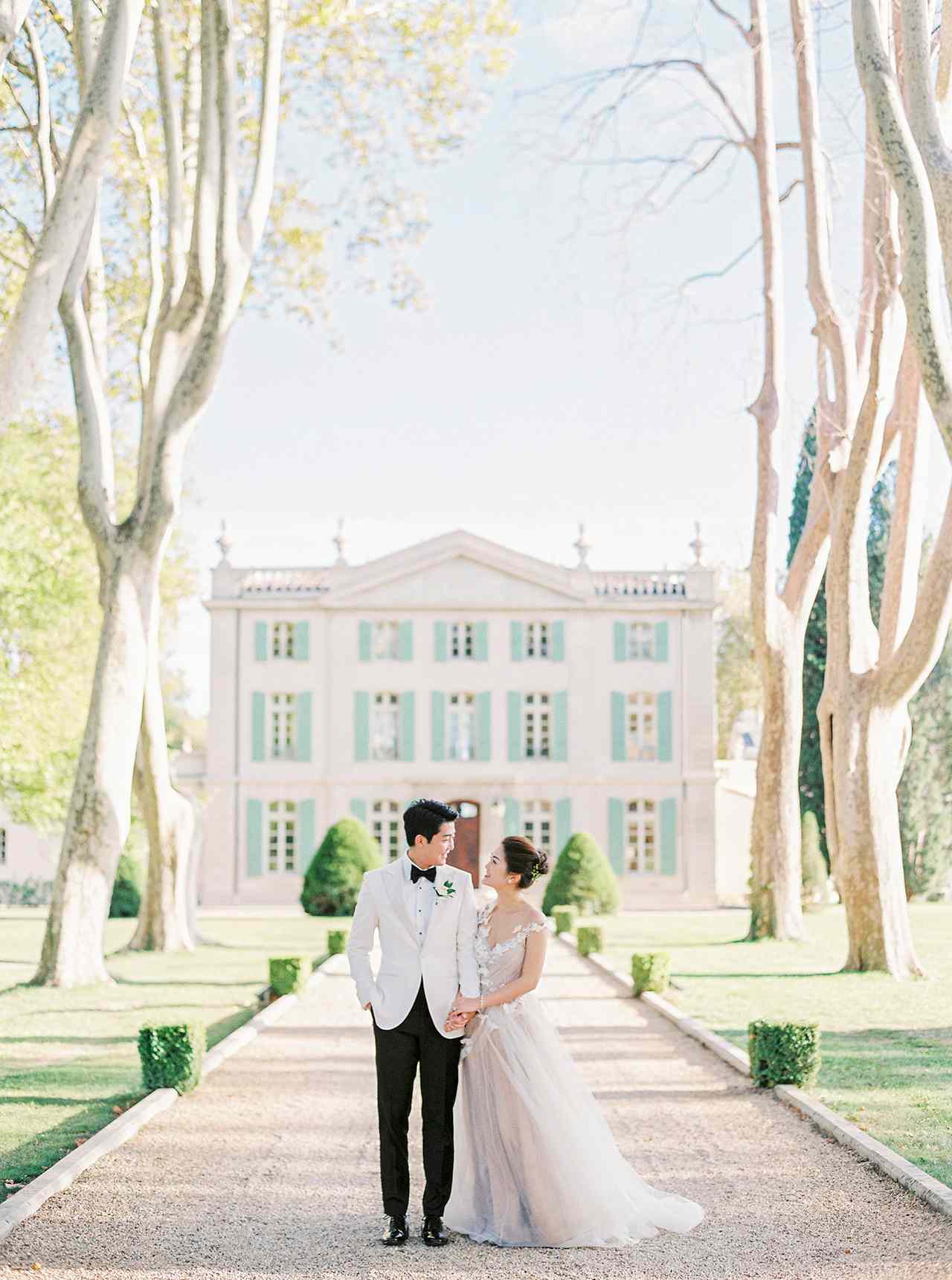 nancy sangho wedding couple in front of chateau