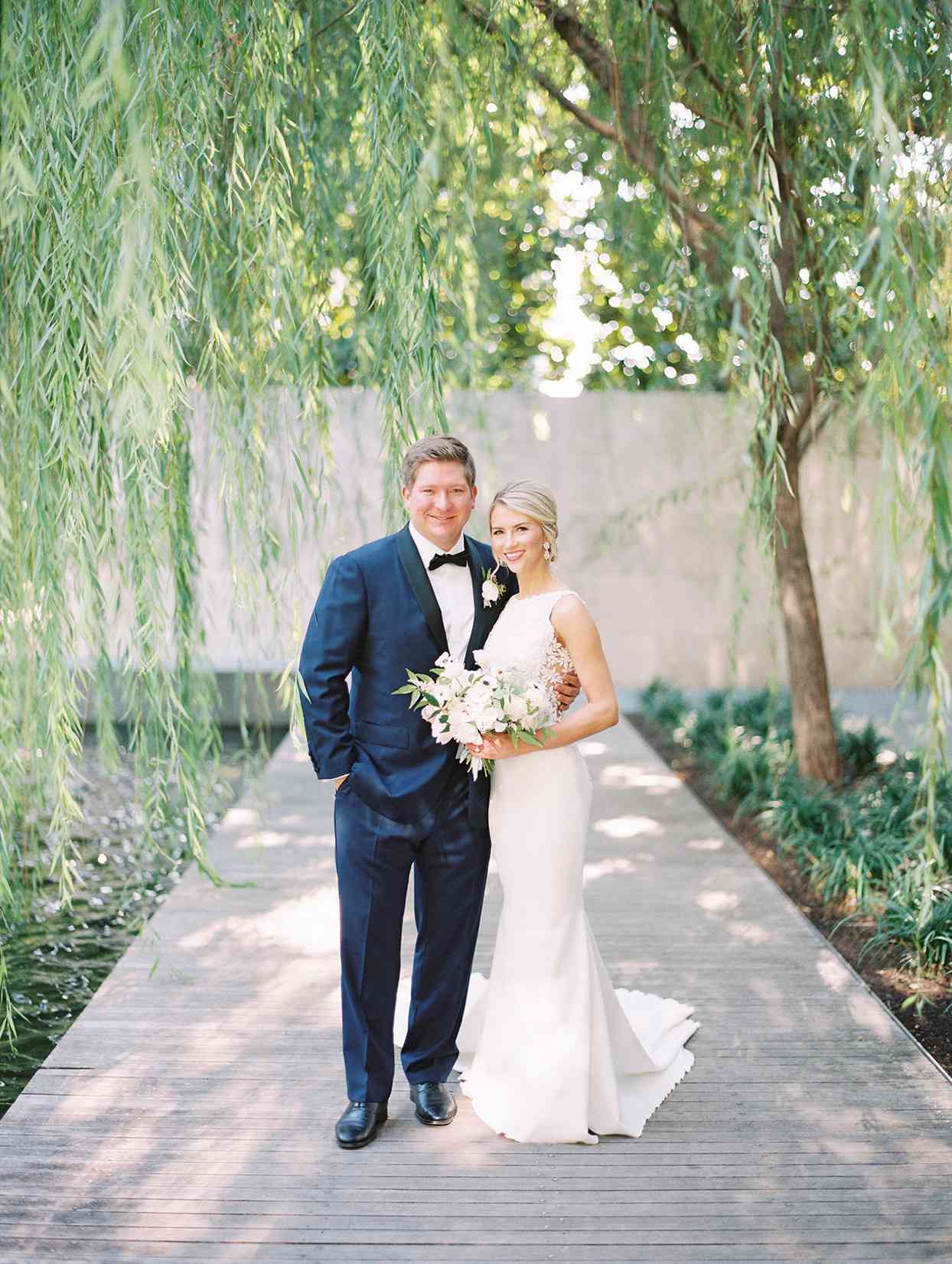 wedding couple portrait on boardwalk under willow tree