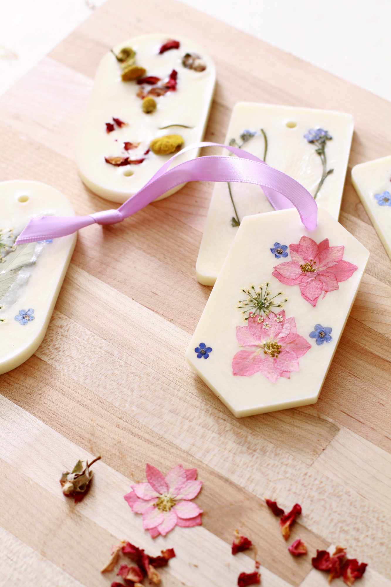 floral wax satchets on wood surface