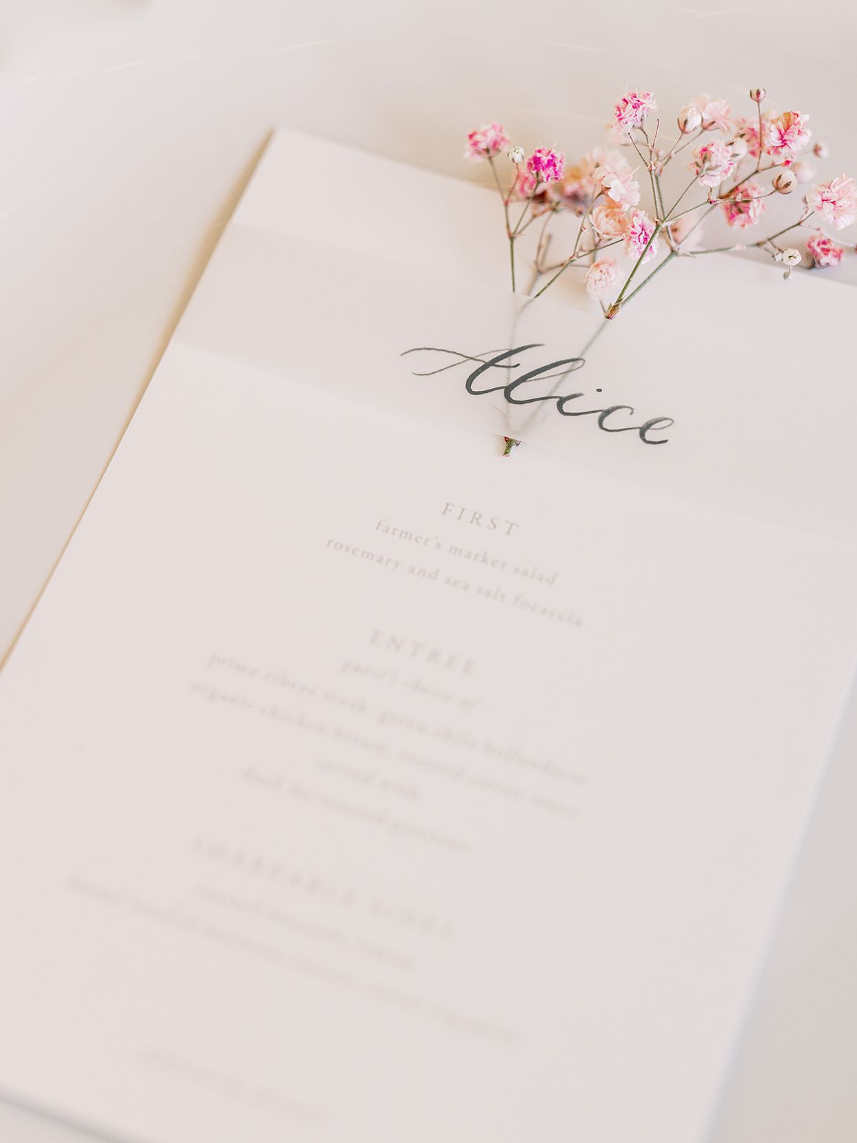 simple elegant white dinner menus with pink flower