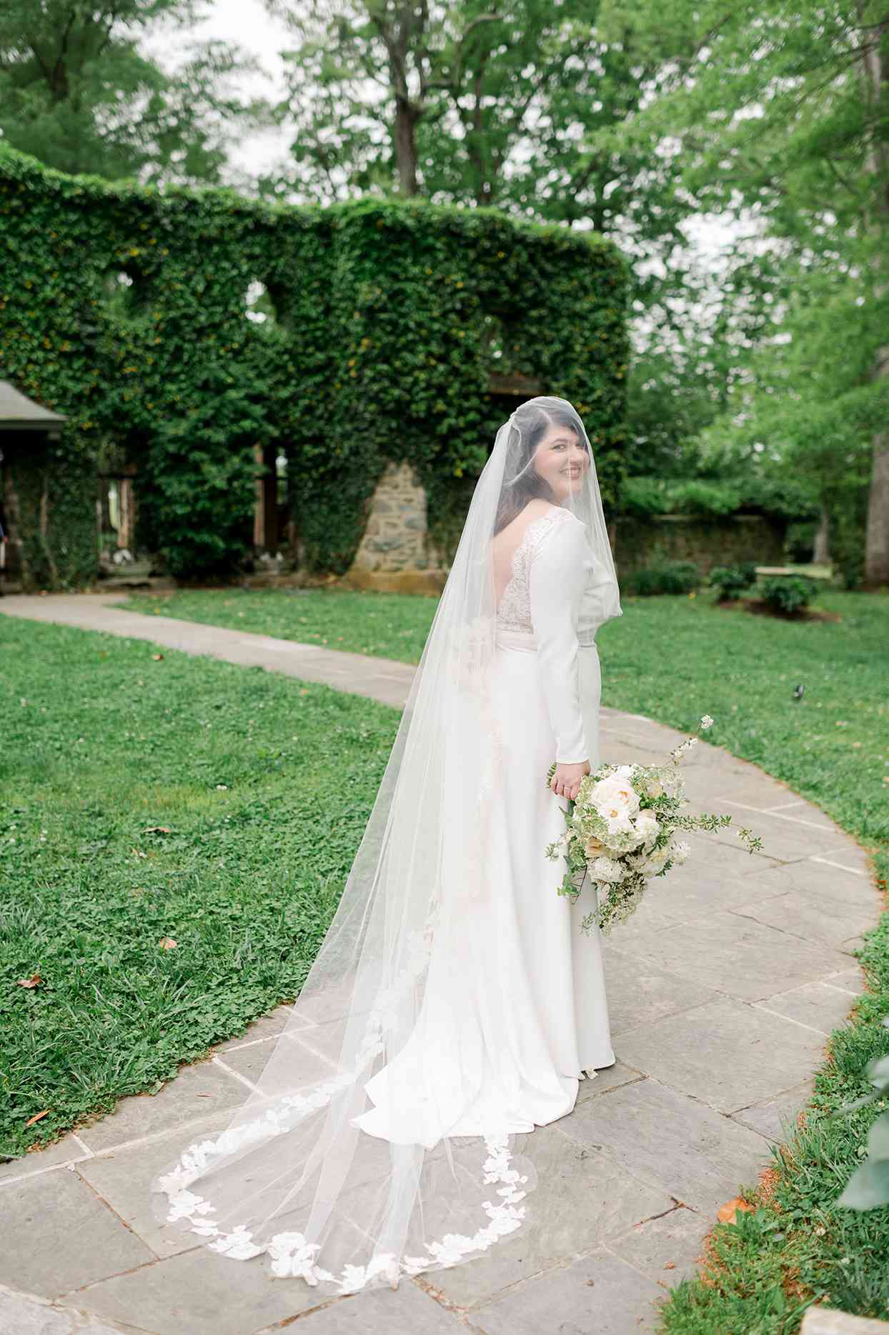 crepe wedding gown from BHLDN with tailored silhouette and long sleeves with covered buttons