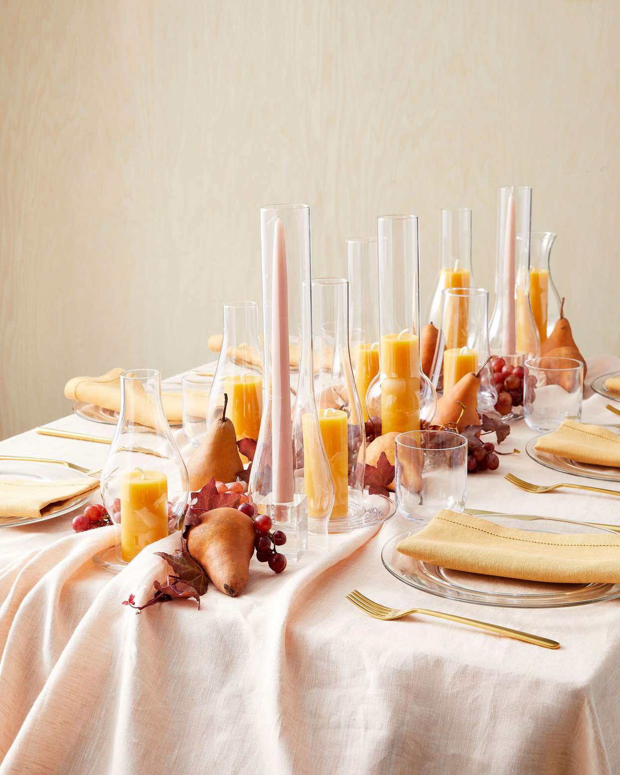 fall table setting with chimney vases and candles