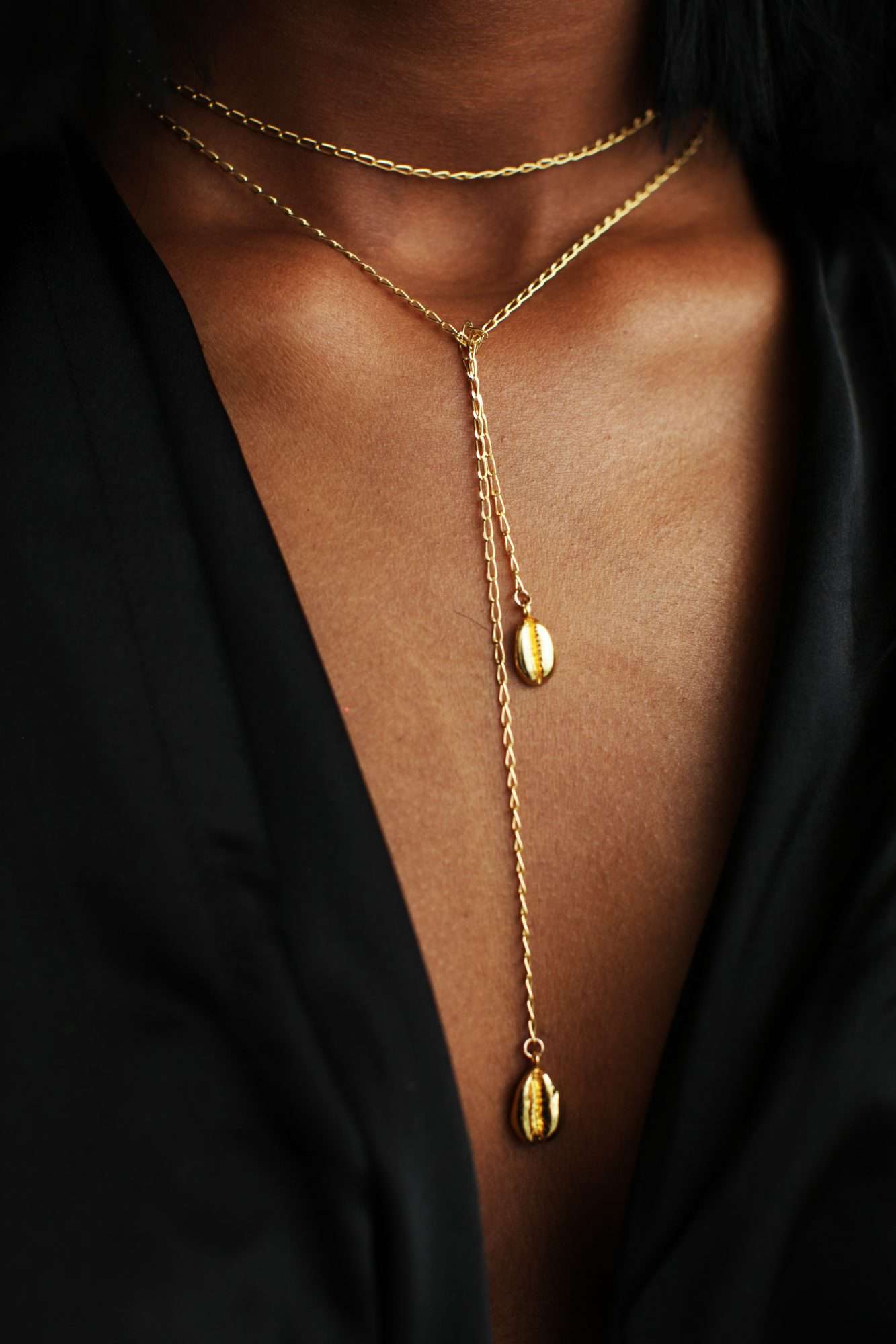 cowrie and infinity necklace by Omi Woods