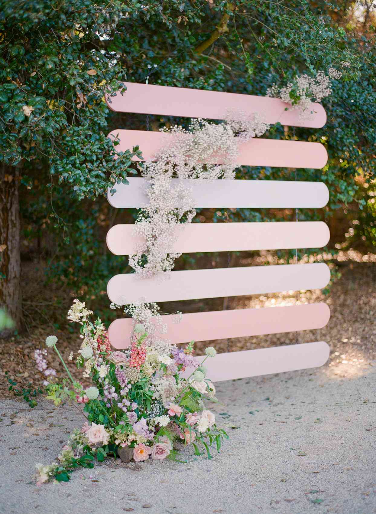 various pink toned wedding ceremony backdrop