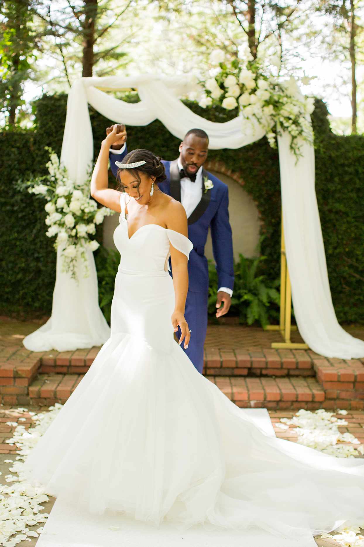 groom twirls bride during first look