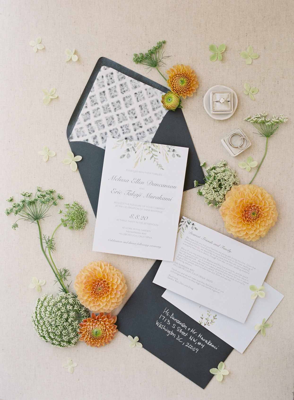 gray, white, and orange wedding invitations