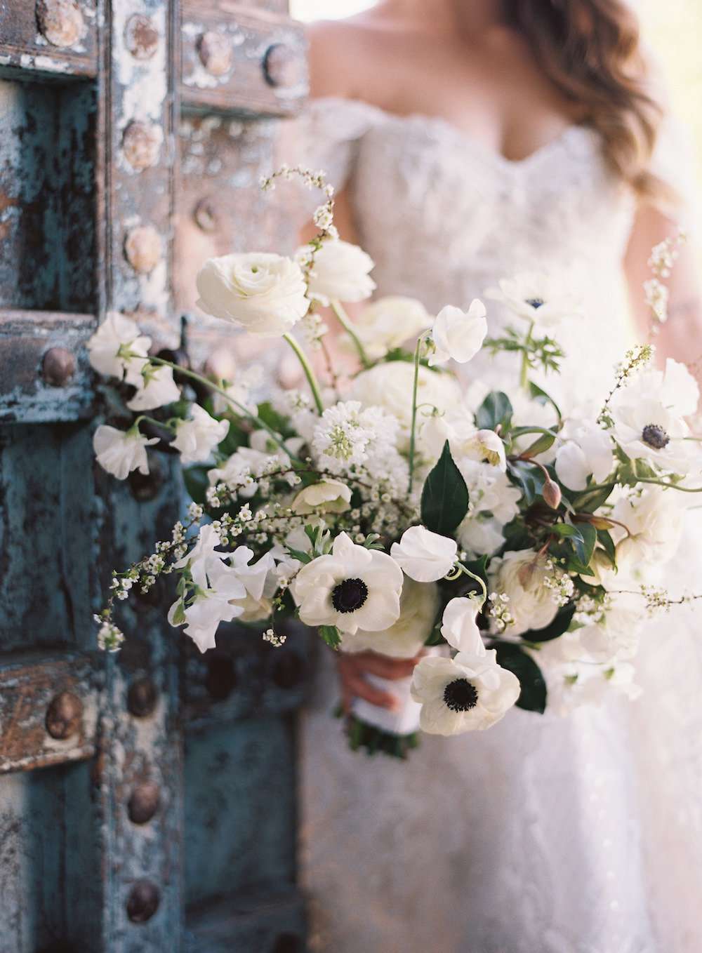 ivey trevor wedding bride holding white floral bouquet
