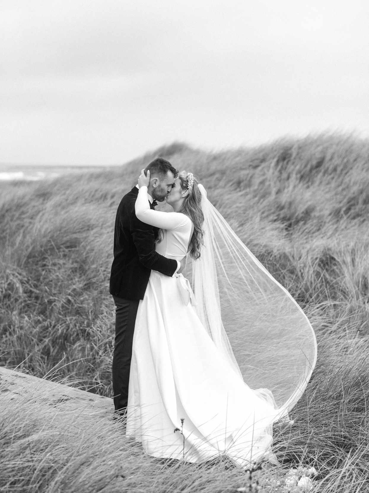 wedding couple kissing on Irish countryside
