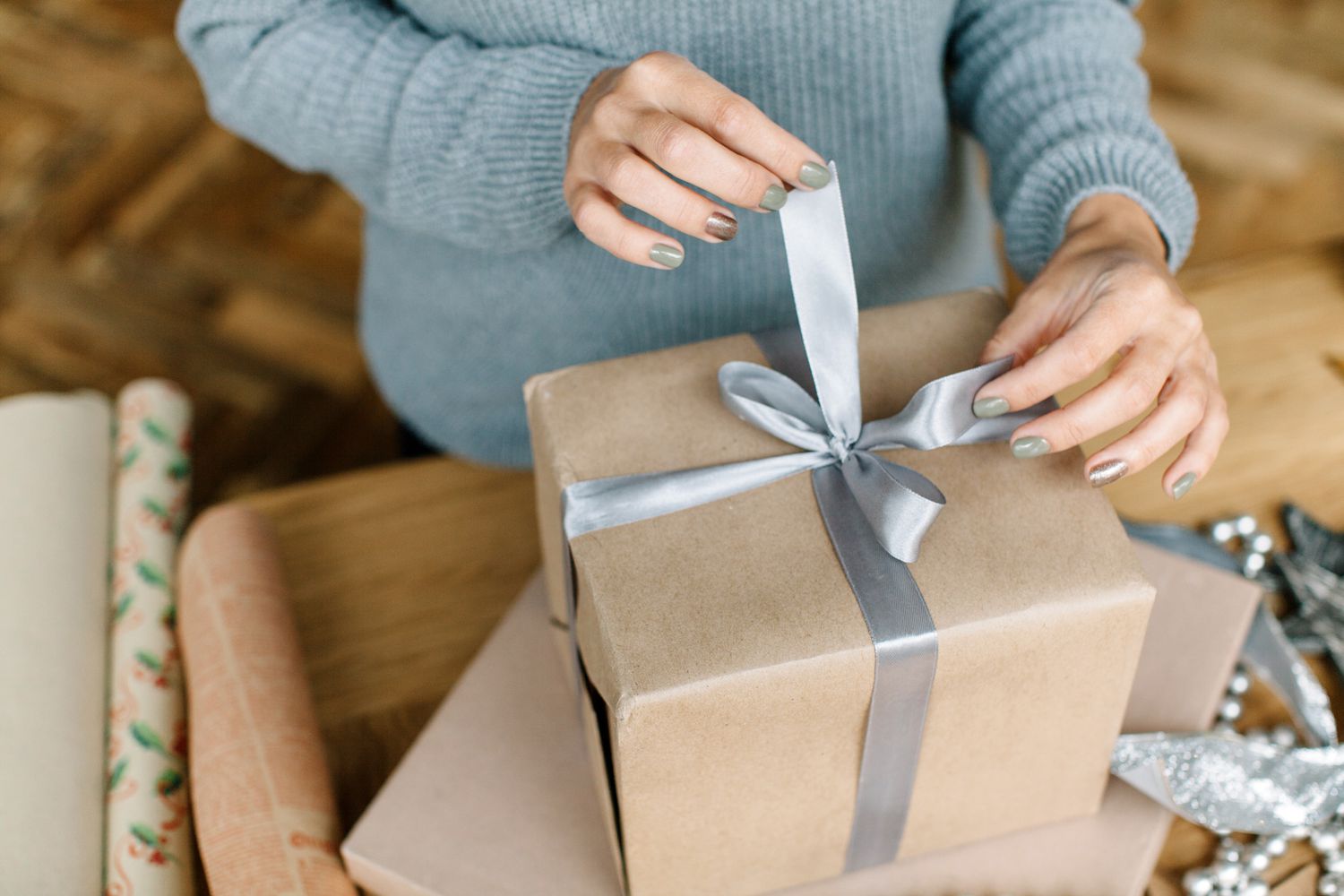 woman wrapping holiday gift