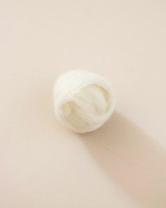 wool dryer ball project wool wrapped into tennis ball shape