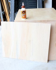 wooden slab next to table with wood glue
