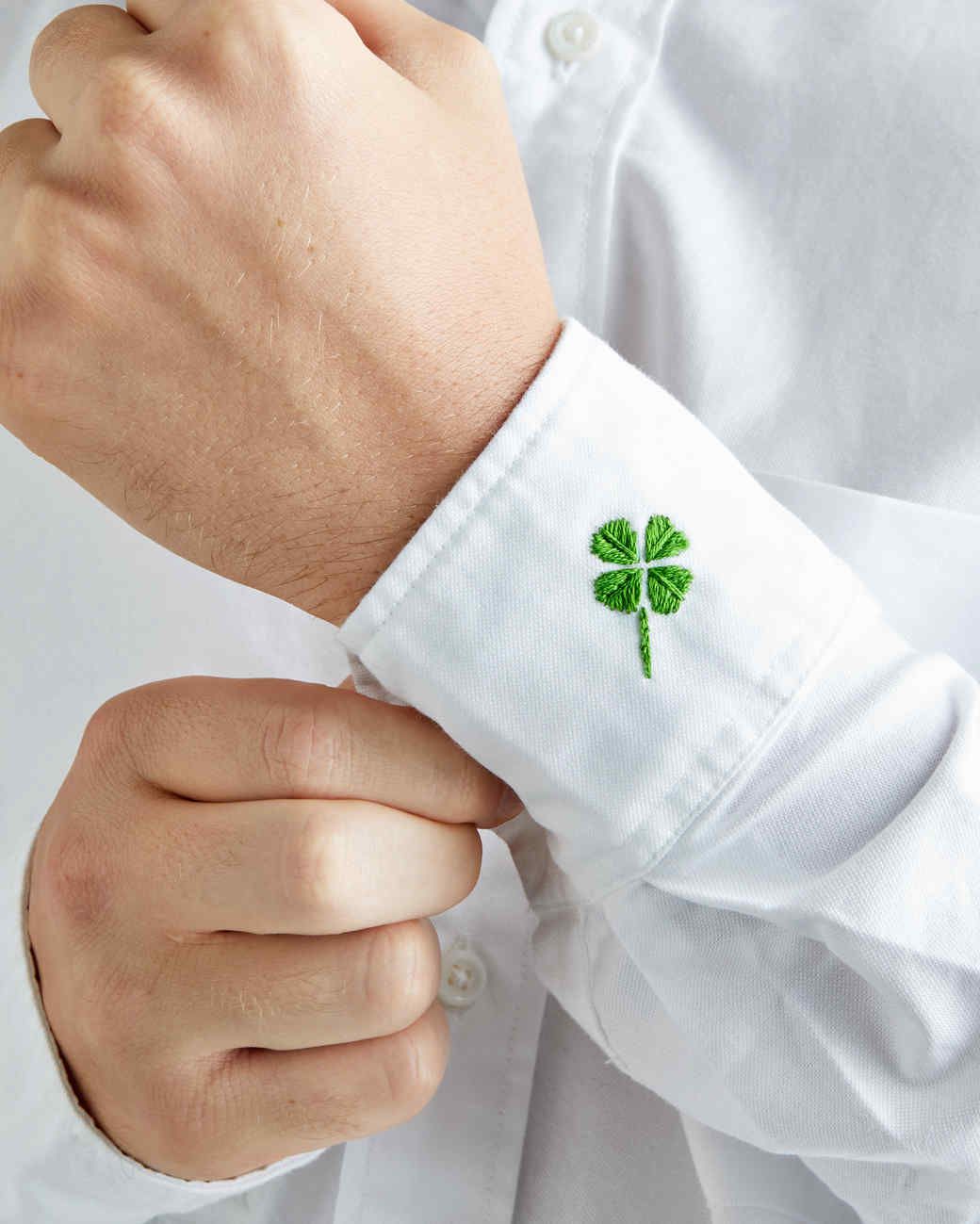 embroidered four-leaf clover on a man's shirt cuff