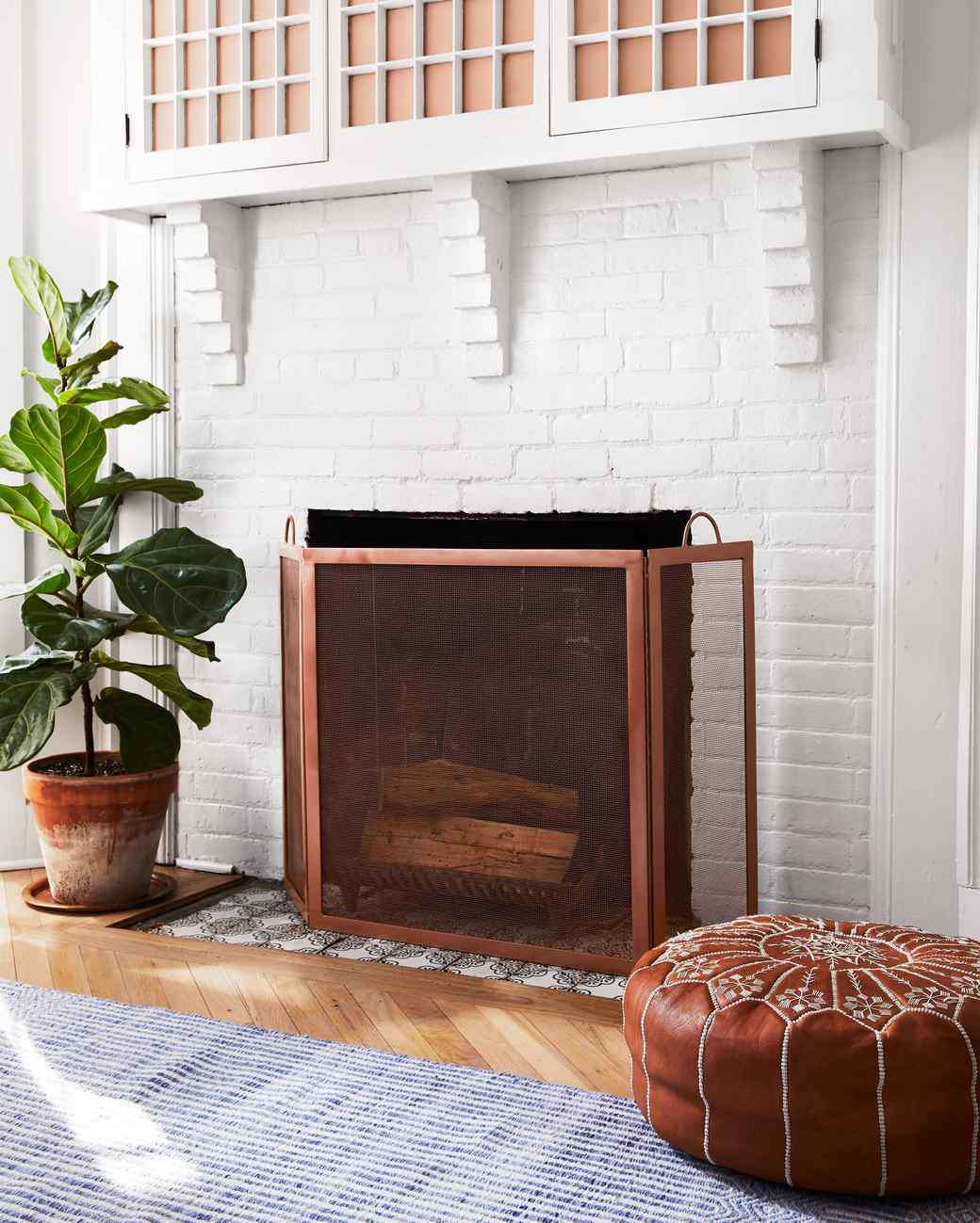 white brick fireplace with painted cover