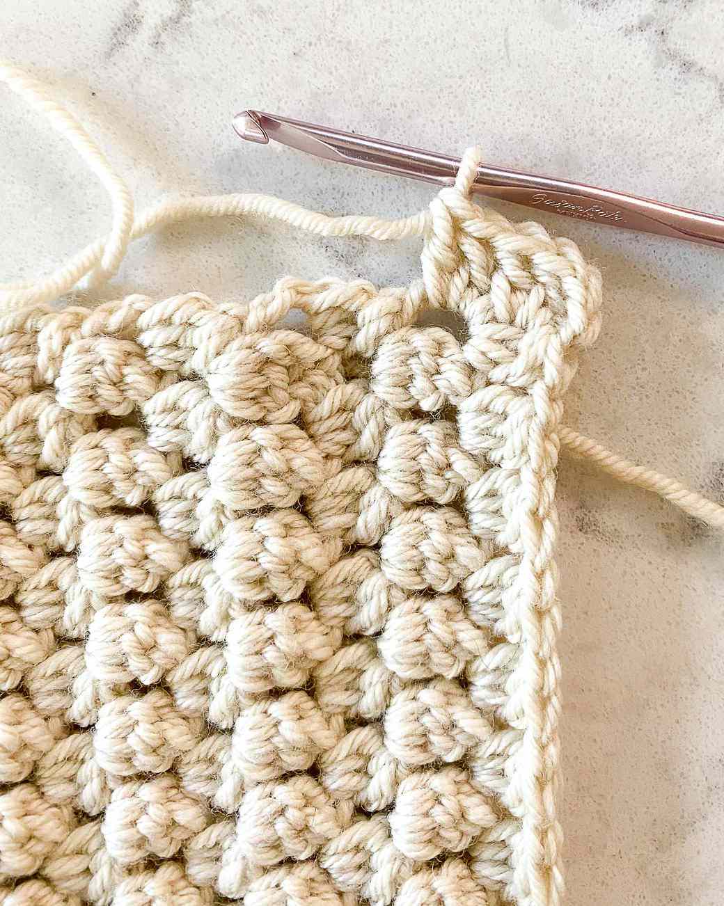 making the soft bobble stitch for a crochet baby blanket
