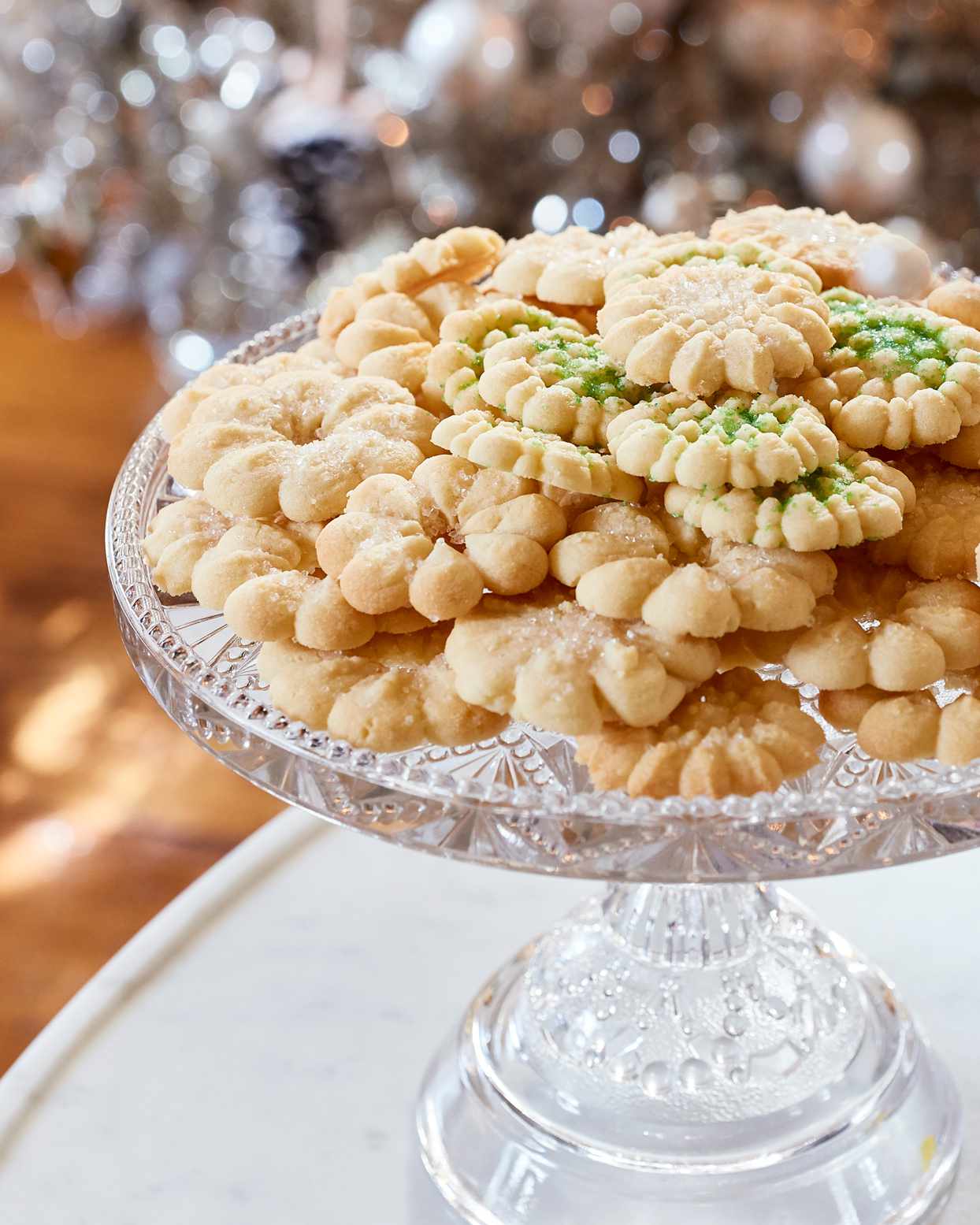 buttery spritz cookies on elegant glass stand
