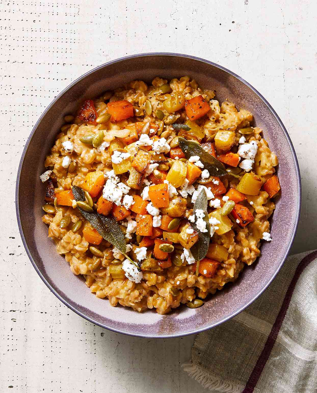 baked farro risotto with golden vegetables and goat cheese