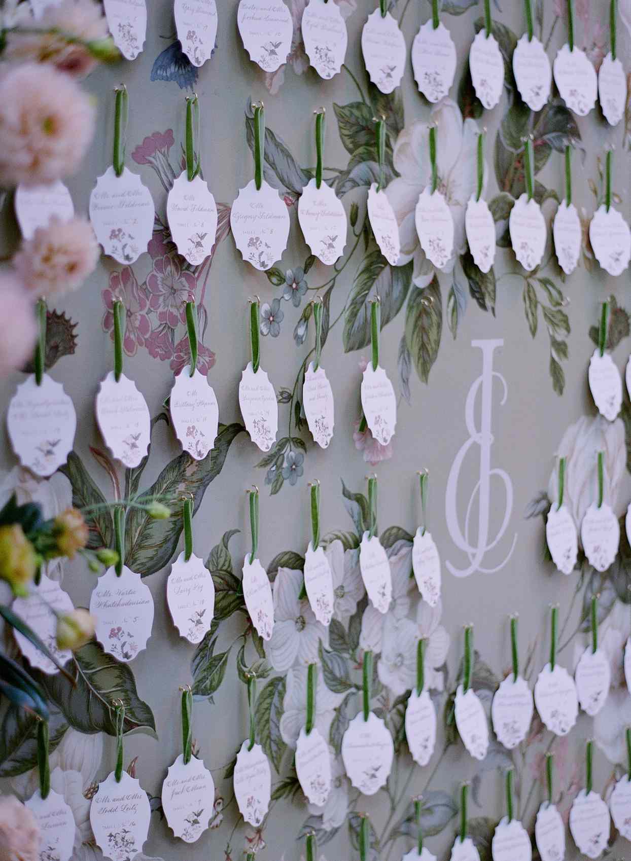 cut out elegant place cards hanging on wall