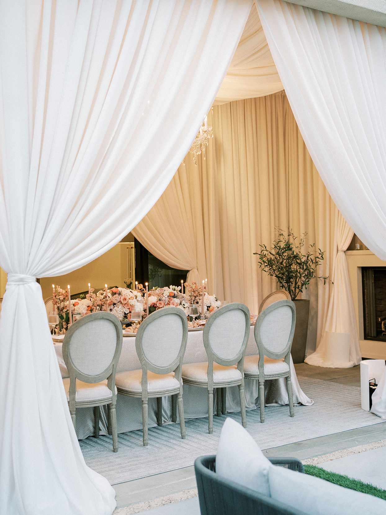 white linen curtain draped wedding reception area