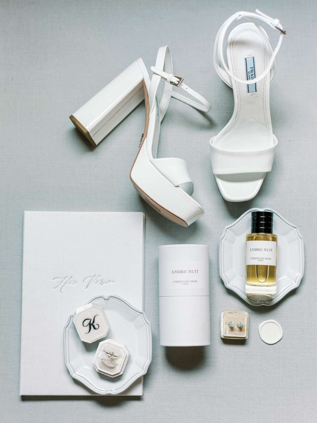 bride's elegant white wedding accessories and perfume
