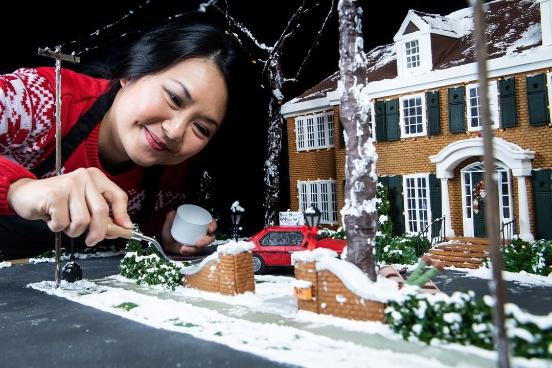 Michelle Wibowo working on Home Alone gingerbread house