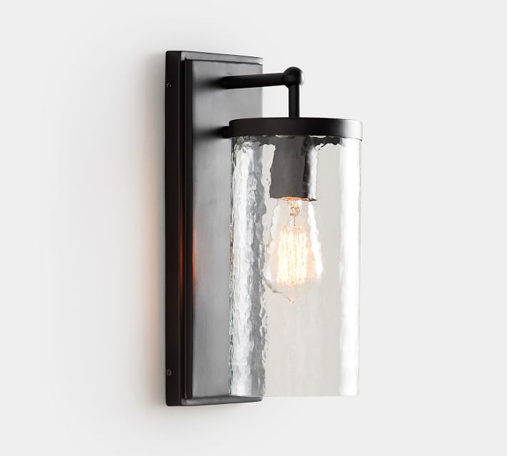 lighted wall sconce in brass with recycled glass shade