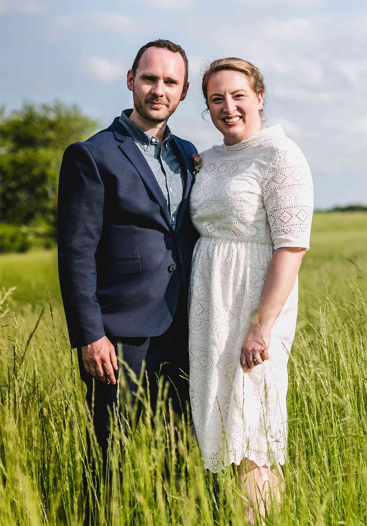 bride and groom in tall grass