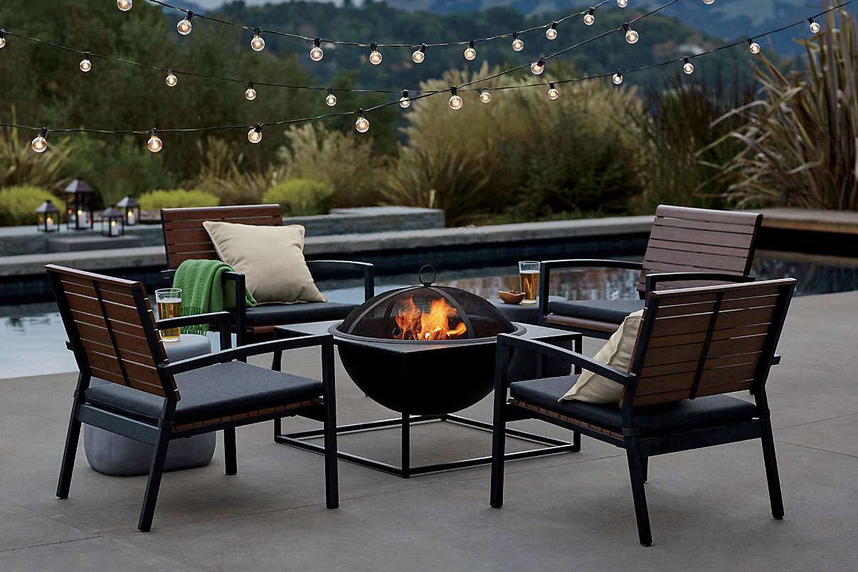 globe string light above outdoor fire pit on patio