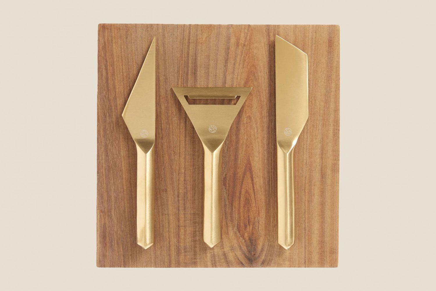 gold plated cheese knives and wood block