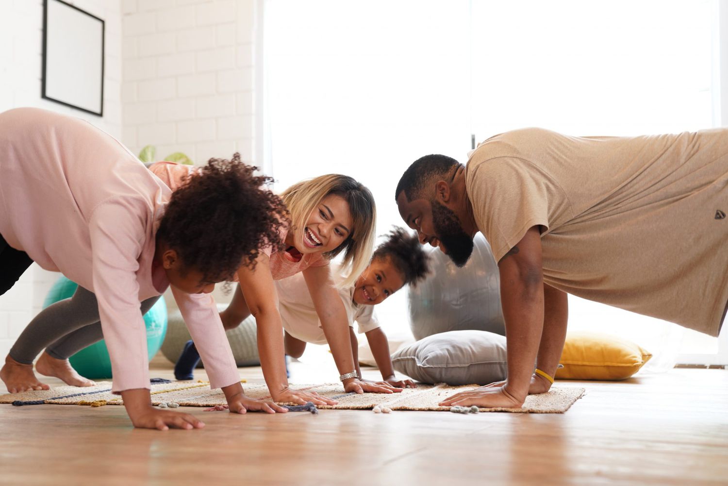family exercising on floor