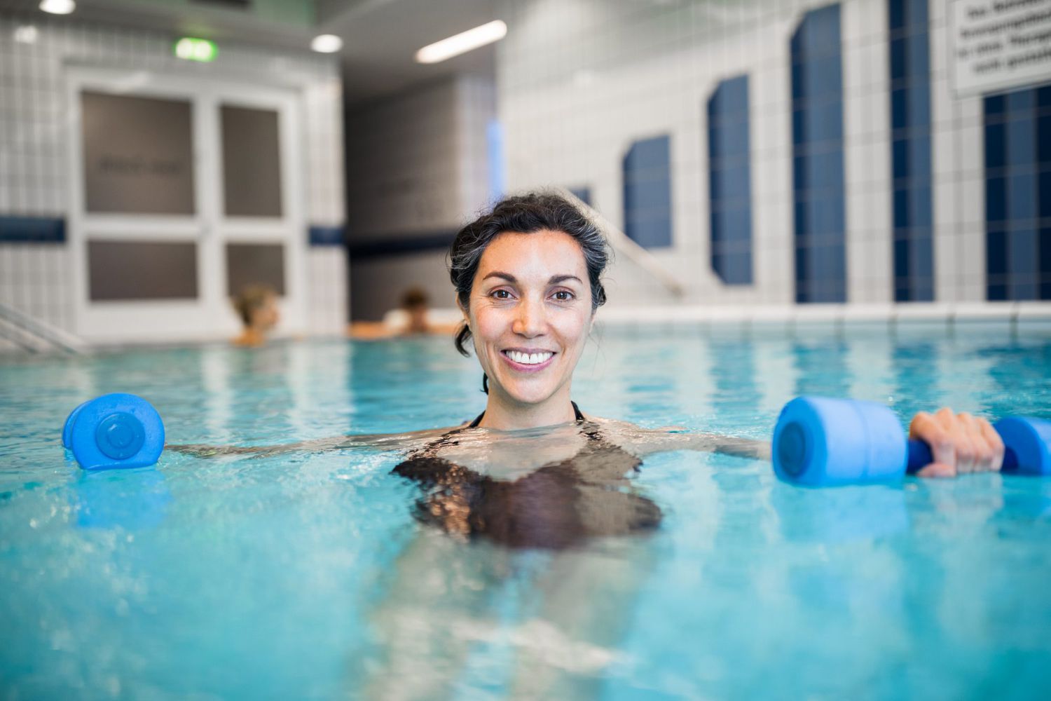 woman exercising in swimming pool