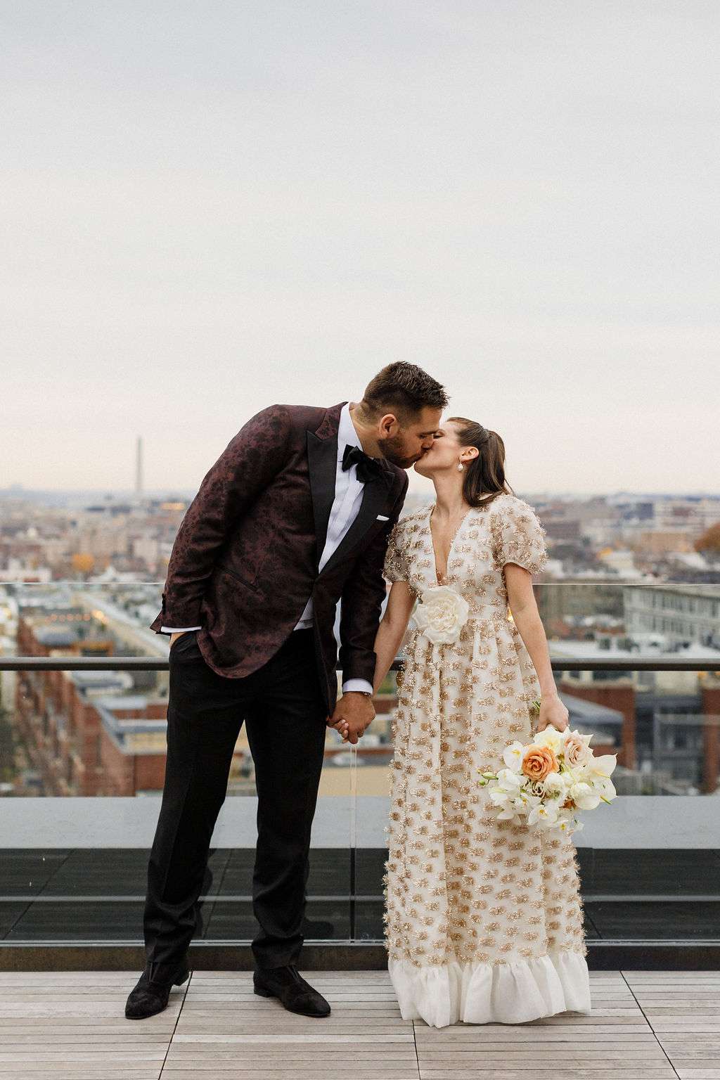 wedding couple kiss portrait on rooftop