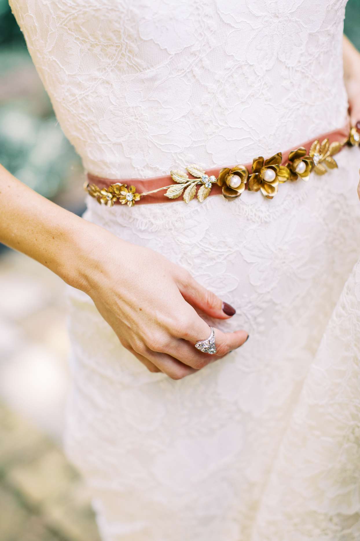 velvet gold, jeweled belt on bride's dress