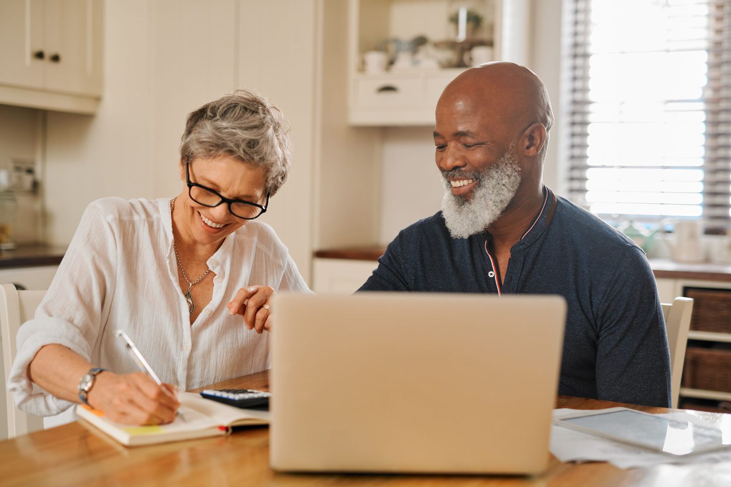 retired couple filling out tax forms