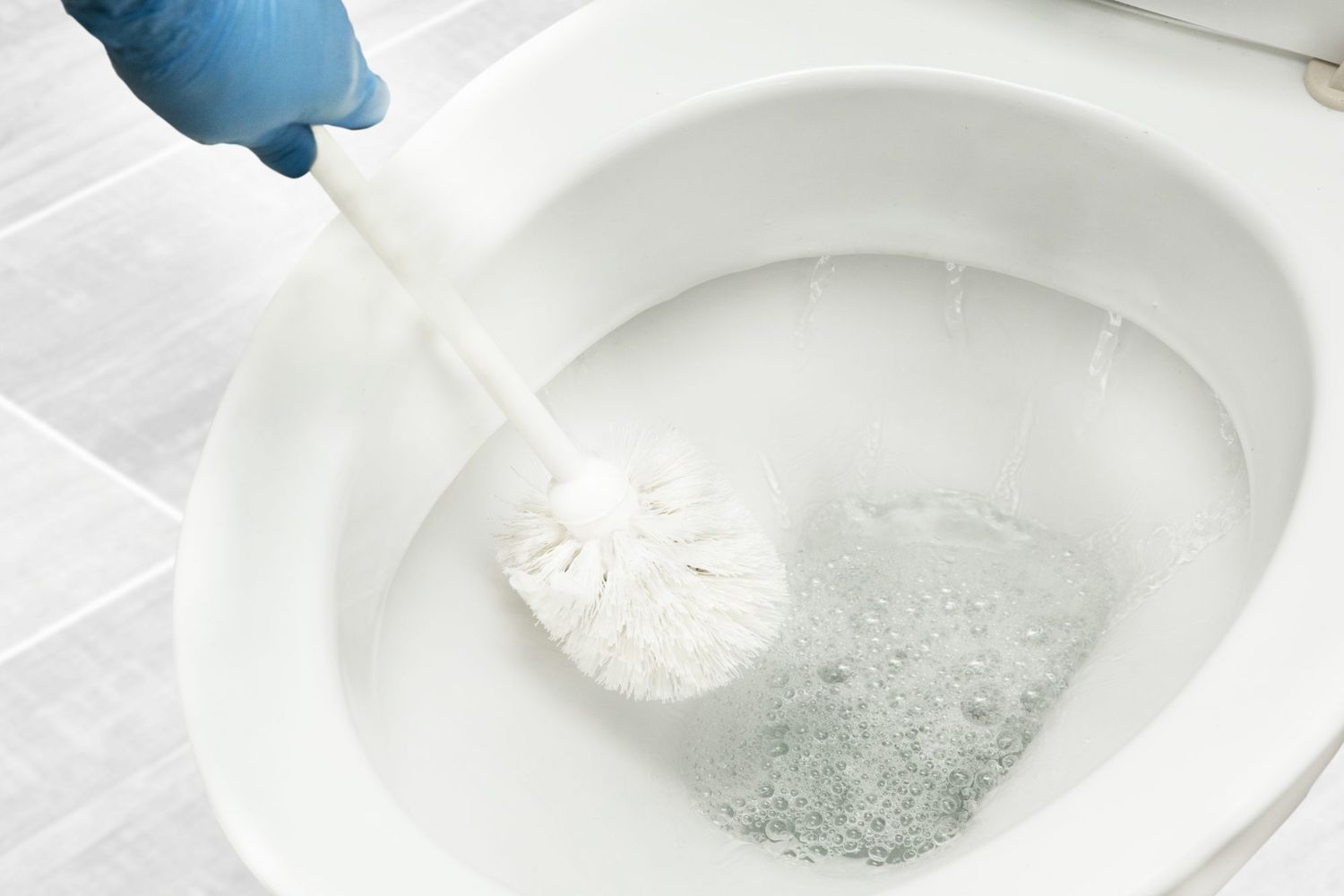 scrubbing toilet with brush