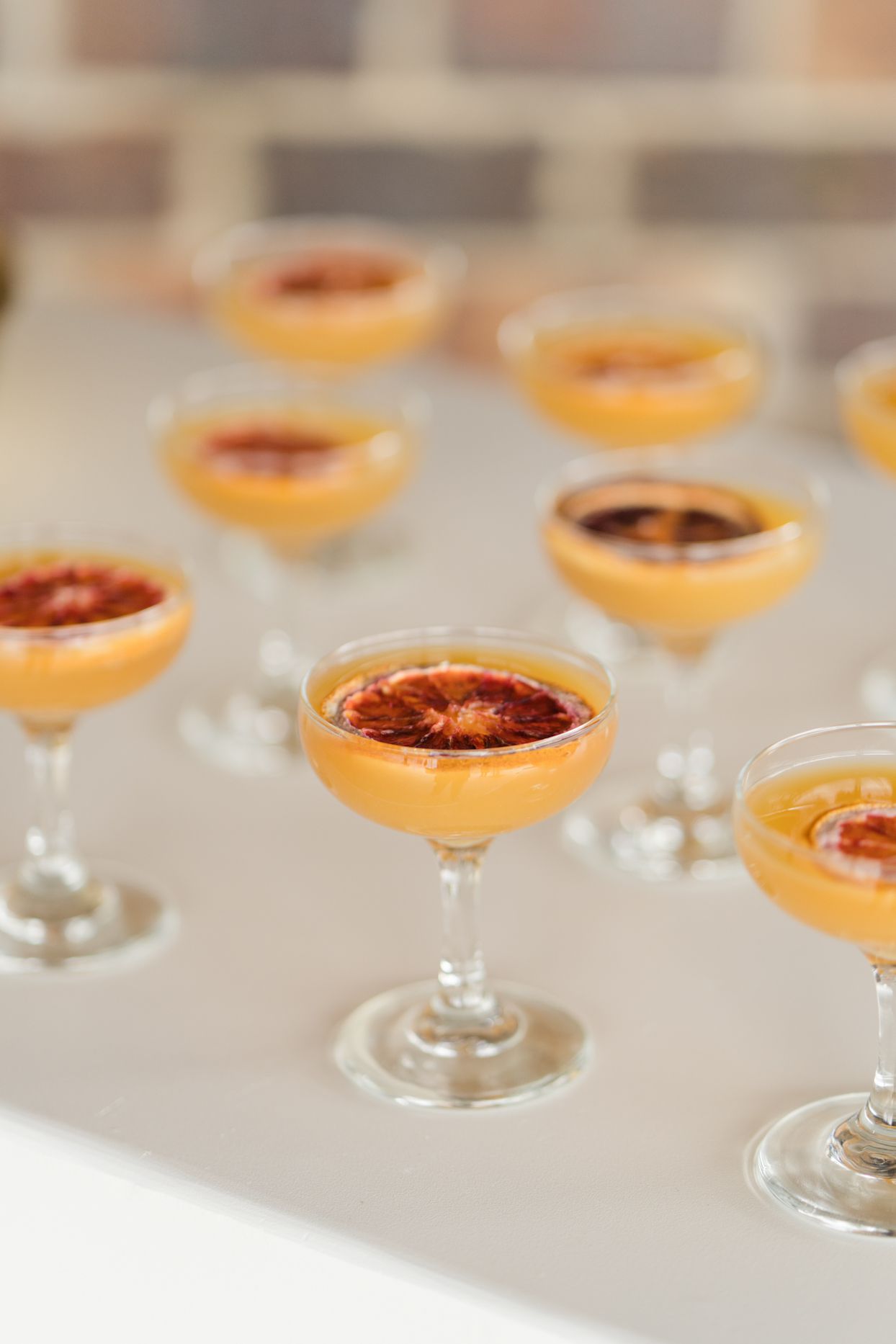 orange wedding cocktails with sliced citrus