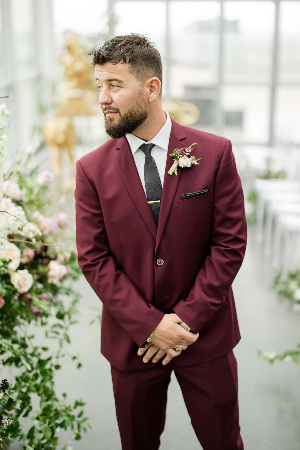 groom in maroon suit