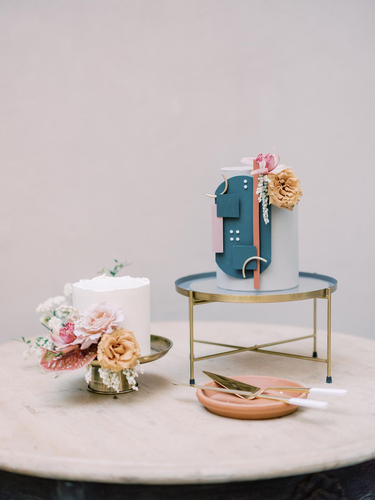 contemporary yahtzee-inspired wedding cake embellished with flowers