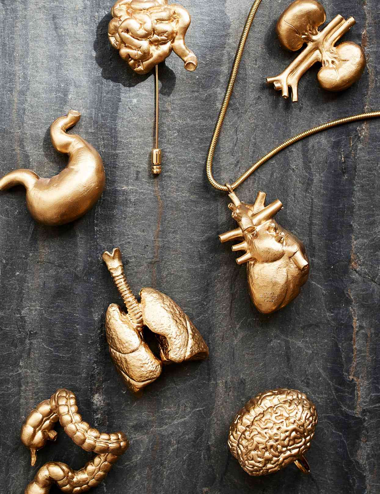 Gold spray-painted toy organs
