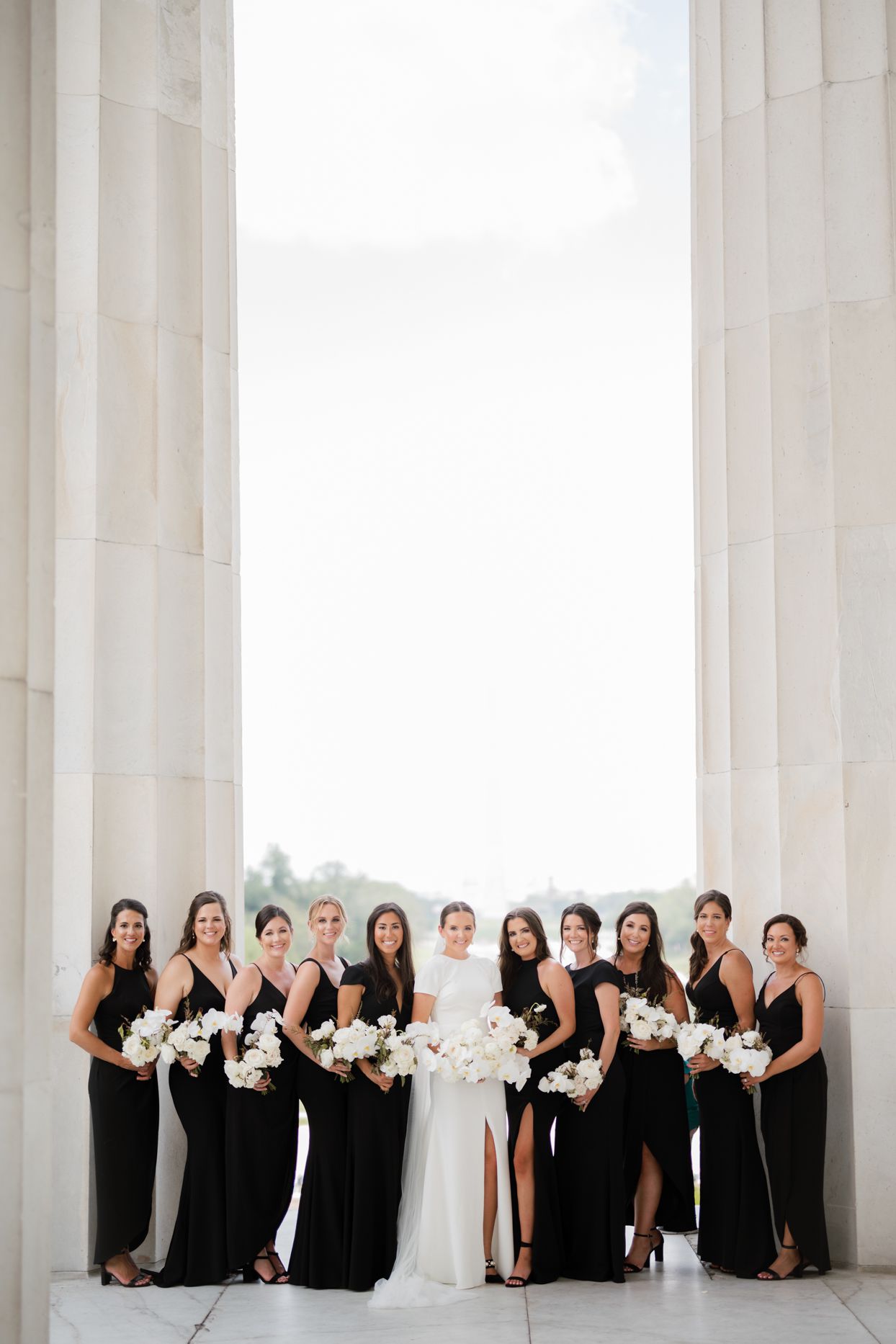 bride with bridesmaids in black dresses