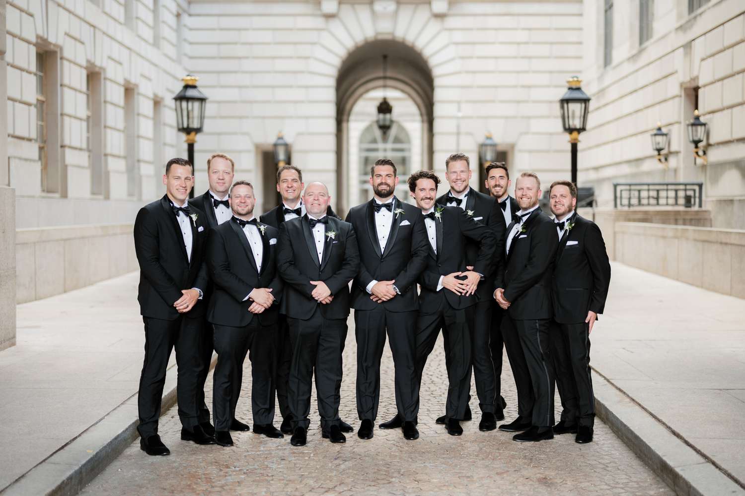 groom with groomsmen in tuxedos