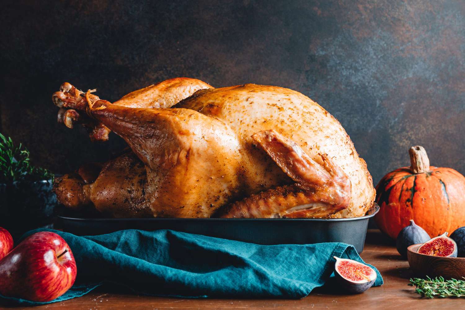 roasted thanksgiving turkey resting in pan on table