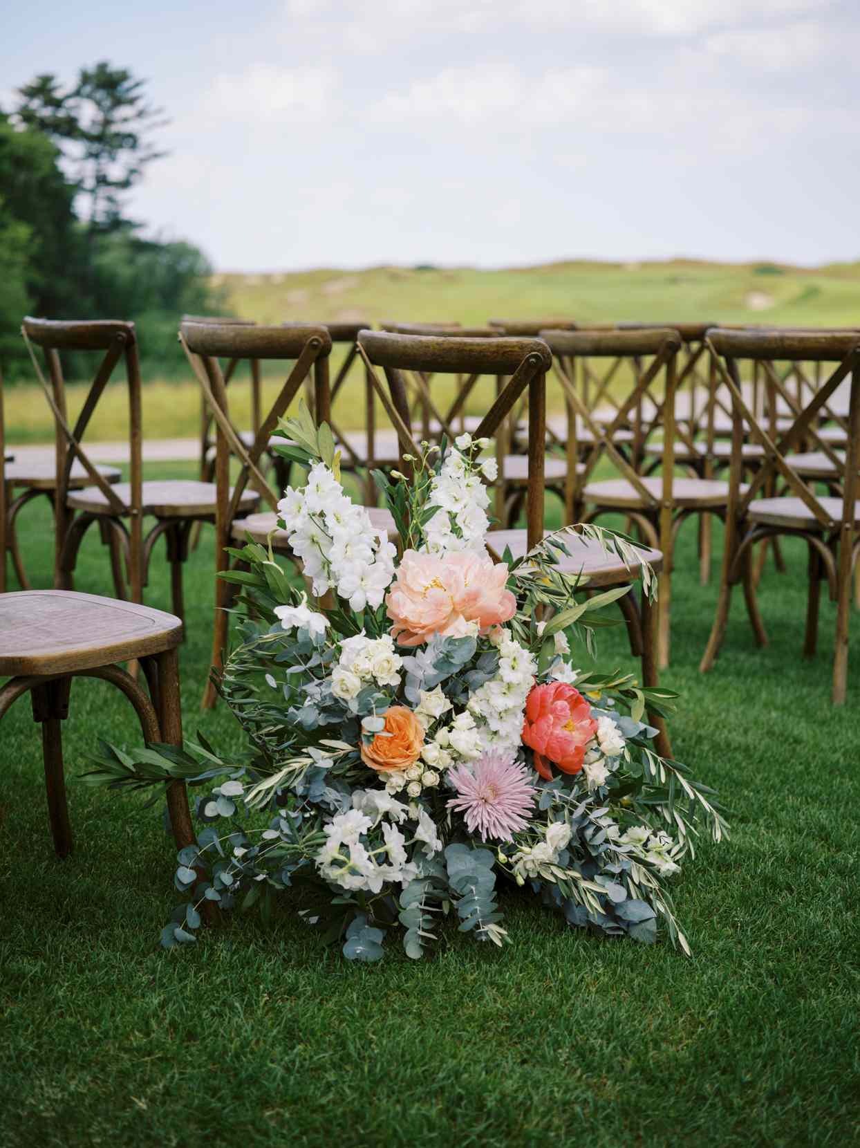 outdoor ceremony flowers in aisle